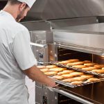 Modern commercial oven in a busy professional kitchen